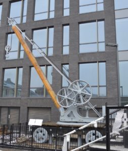 Photo of restored crane derusted and painted pale grey, in its new resting place in Bath