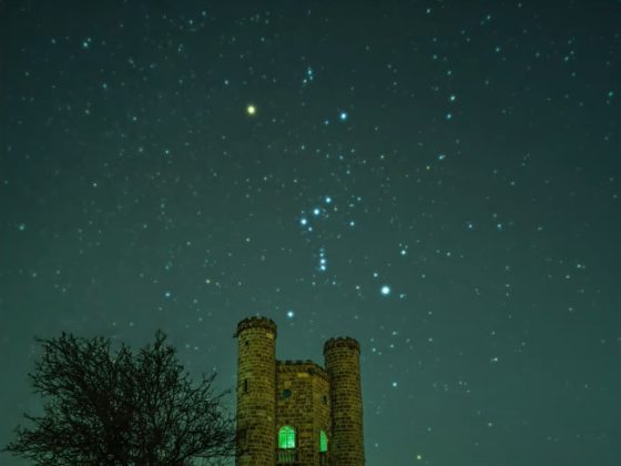 Image is astrophotography of Orion over Broadway Tower. Image by Russell Discombe.