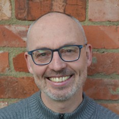 Photo is a portrait picture of Ben Spencer